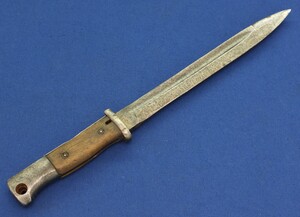 A German WW2 Model 1884-89 Bayonet for Mauser K98 Rifle. Marked and dated 44 CVL for Weyersberg-Kirschbaum&Co Solingen. Length 38cm. Crude made in fair/good condition. Price 85 euro