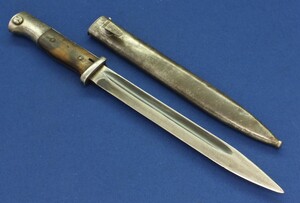 A German WW2 Model 1884/98 Bayonet dated 1938. Bayonet marked Coppel Gmbh, nr. 2696 I, Scabbard marked Carl Eickhorn 1938, nr.3995 S. Waffenambt stamps WaA255 on pommel. Length 40cm. In good condition. Price 215 euro