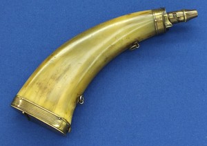 A rare antique 19th century green horn powder flask with Brass Mounts and hinged lid at the bottom with space for caps. Height 24,5 cm. In very good condition. Price 285 euro.