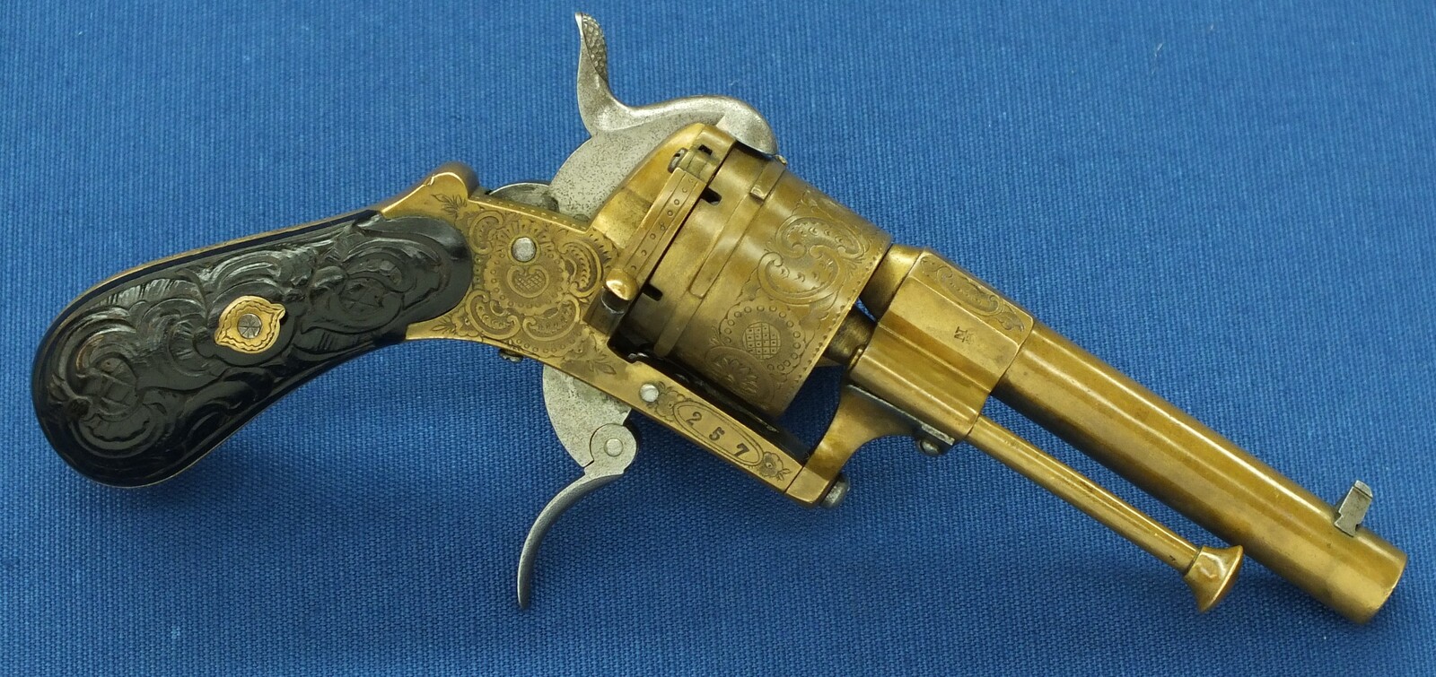 A rare antique Belgian Bronze 6 shot engraved Single and Double Action Pinfire Revolver. Caliber 7mm, length 20cm. In very good condition. Price 775 euro.