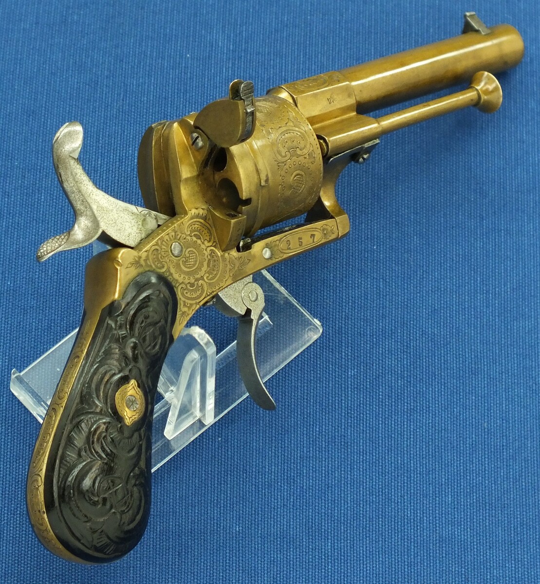 A rare antique Belgian Bronze 6 shot engraved Single and Double Action Pinfire Revolver. Caliber 7mm, length 20cm. In very good condition. Price 775 euro.