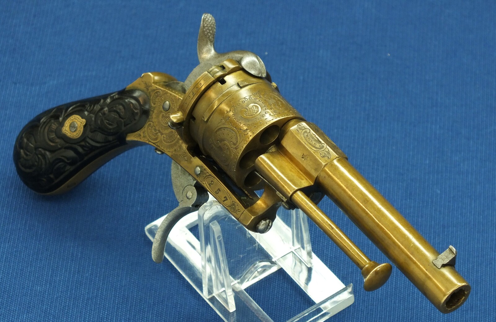 A rare antique Belgian Bronze 6 shot engraved Single and Double Action Pinfire Revolver. Caliber 7mm, length 20cm. In very good condition. Price 775 euro.