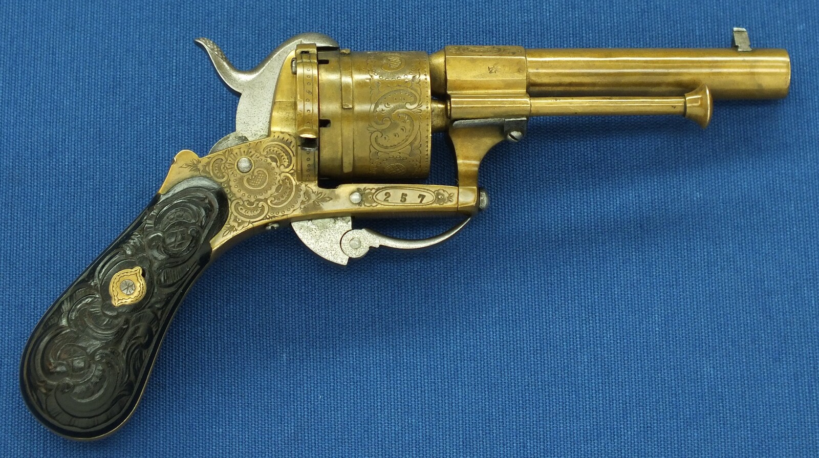 A rare antique Belgian Bronze 6 shot engraved Single and Double Action Pinfire Revolver. Caliber 7mm, length 20cm. In very good condition. Price 775 euro.
