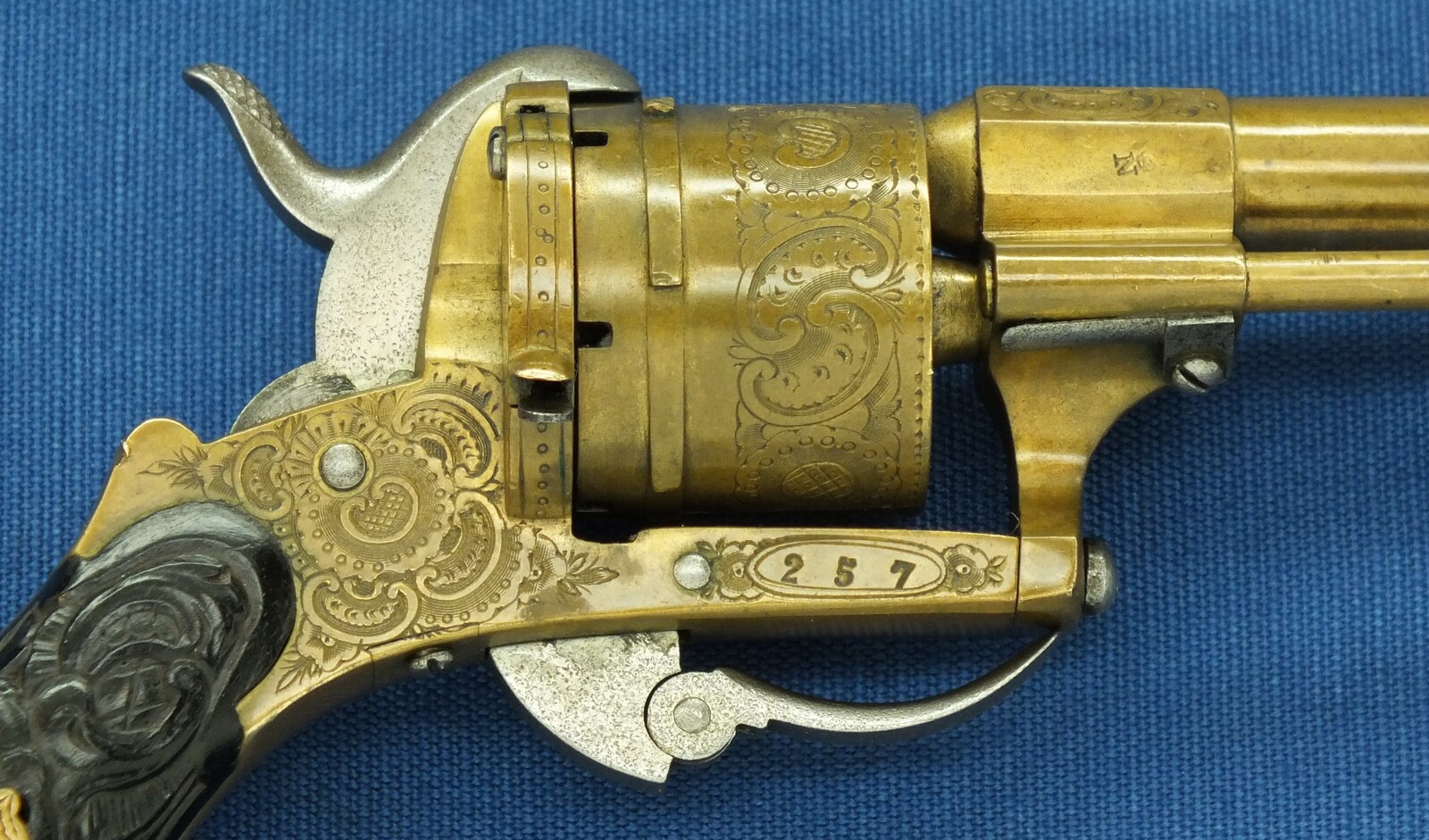 A rare antique Belgian Bronze 6 shot engraved Single and Double Action Pinfire Revolver. Caliber 7mm, length 20cm. In very good condition. Price 775 euro.