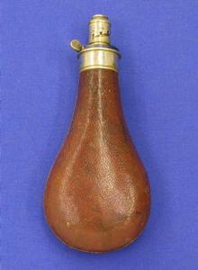 A very nice antique 19th century leather covered English Antique Powder Flask in Berlin Silver, by G. & J.W. Hawksley Sheffield, 20 cm.in very good condition. Price 425 euro