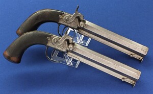 An antique English pair of 16 bore smooth Percussion Man Stopper Belt pistols by Brown & Rodda Titchborne St. London`with 6 inch octagon Damascus Barrels. Length 32cm. In very good condition. Price 2.850 euro.