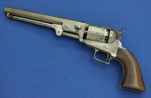 An antique rare First Model Colt 1851 Square back Navy Percussion Revolver with wedge over screw,  .36 caliber, 7 1/2 inch barrel with New York address, in very good condition.  