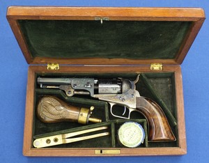 An excellent antique American cased factory engraved Colt Baby Dragoon with rammer 5 shot perkussion revolver. 31 caliber with 4 inch barrel with 2 line New york address. In mint condition. 
