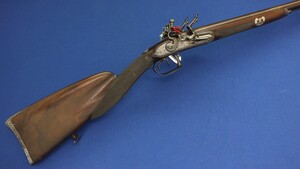 A Belgian Double barreled Flintlock Sportin Rifle by Michel Berleur Liege (1780-1810) With rainproof pan's with safety covers released by a spring-catch at the front of the steels. Caliber 15mm. Length 122cm. In very good condition.