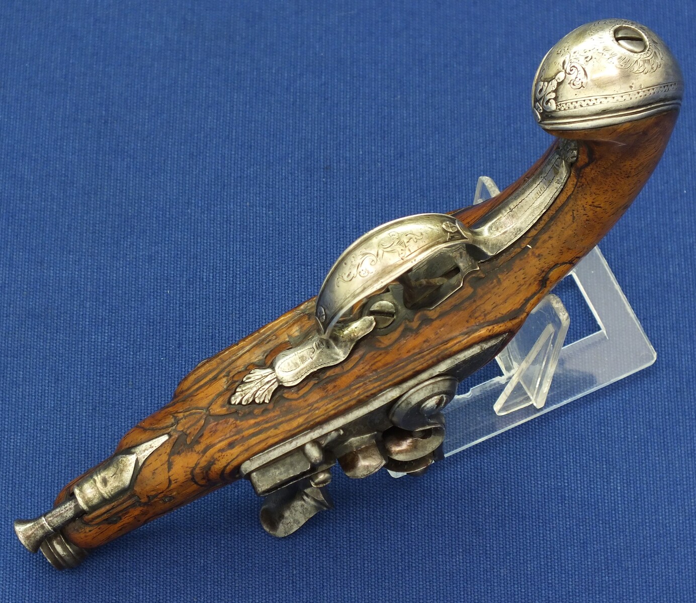 A fine antique 18th century French Silver mounted small Flintlock Pocket pistol circa 1760. Caliber 10mm rifled, length 18,5cm. In very good condition. Price 1.250 euro.