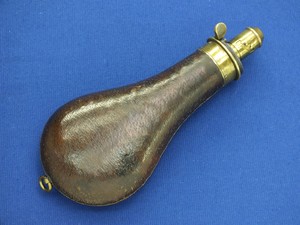 A fine antique 19th Century Leather Covered English Powder Flask signed 