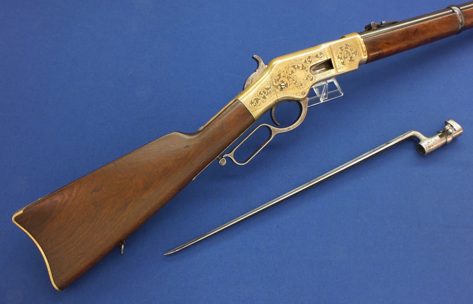 A fine antique American L.D. Nimschke Engraved Winchester Model 1866 Yellow Boy Musket with original Bayonet. 44 Henry Rimfire caliber, 27 inch barrel. Length 118cm. In very good condition. Price on request