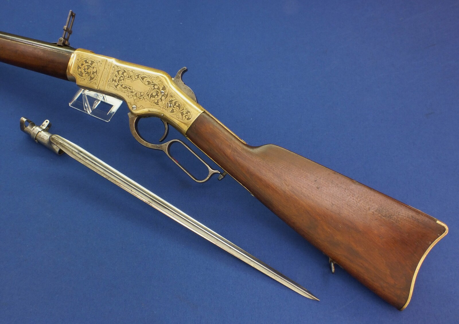 A fine antique American L.D. Nimschke Engraved Winchester Model 1866 Yellow Boy Musket with original Bayonet. 44 Henry Rimfire caliber, 27 inch barrel. Length 118cm. In very good condition. Price on request