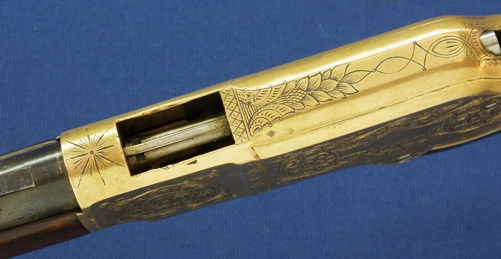 A fine antique American L.D. Nimschke Engraved Winchester Model 1866 Yellow Boy Musket with original Bayonet. 44 Henry Rimfire caliber, 27 inch barrel. Length 118cm. In very good condition. Price on request