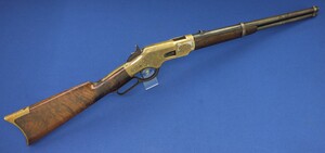 A fine antique American Ulrich Engraved Winchester Third Model 1866 Yellow Boy Saddle ring carbine. Caliber 44 Henry Center fire. In very good condition. 
