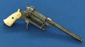 A Fine Antique Belgian engraved 6 shot Pinfire Single and Double Action Pepperbox having a detachable 6 inch barrel. Caliber 9mm. Length 29,5cm. In very good condition. Price 950 euro.