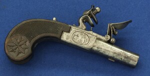 A fine antique circa 1800 French Box-Lock Flintlock pocket pistol with Thumbpiece safety catch. Fine engraved action and fine chequered and carved Walnut butt. Caliber 12mm, length 15cm. In very good condition. Price 850 euro. 