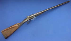 A fine antique English Double Barrel Hammer Gun by E.M. Reilly & Co London. 12 Gauge Caliber, length 118cm. Circa 1875. In very good condition. 