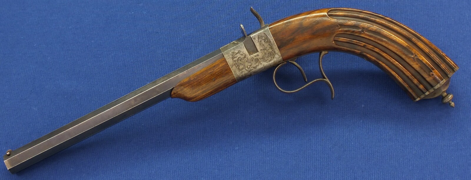 A fine antique French 6mm breech loading percussion target/saloon Pistol with internal hammer.  8 inch octagon barrel. Length 38cm. In near mint condition. Price 995 euro.