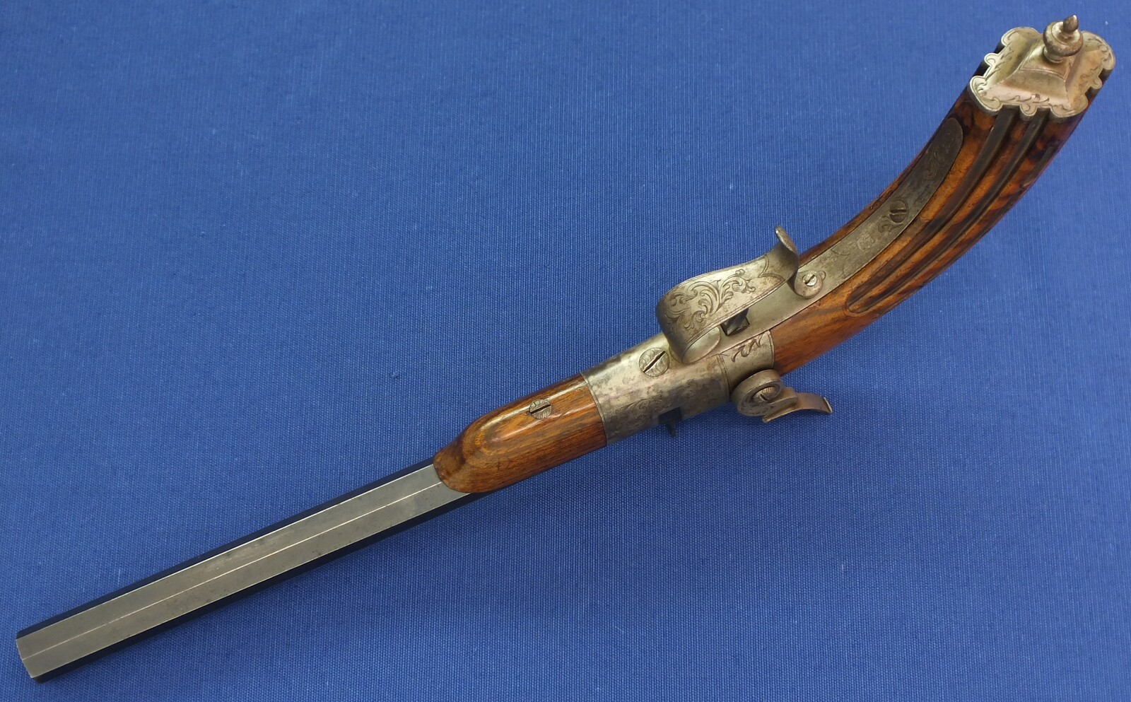 A fine antique French 6mm breech loading percussion target/saloon Pistol with internal hammer.  8 inch octagon barrel. Length 38cm. In near mint condition. Price 995 euro.