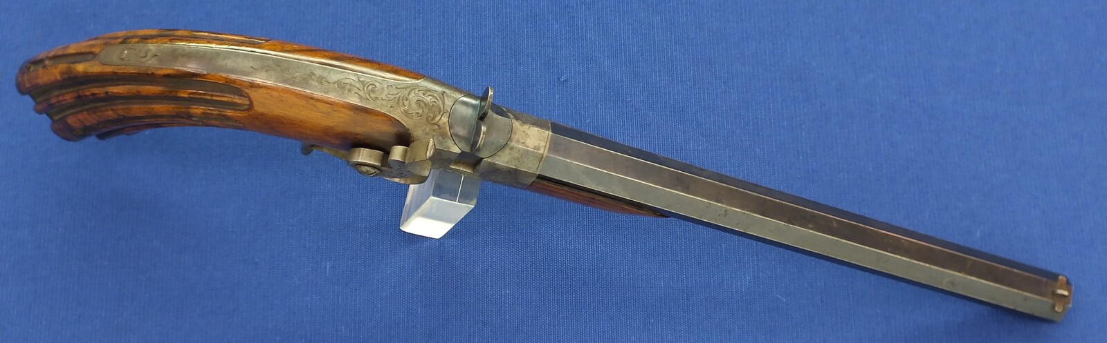 A fine antique French 6mm breech loading percussion target/saloon Pistol with internal hammer.  8 inch octagon barrel. Length 38cm. In near mint condition. Price 995 euro.