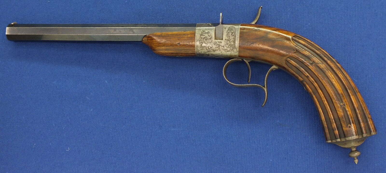 A fine antique French 6mm breech loading percussion target/saloon Pistol with internal hammer.  8 inch octagon barrel. Length 38cm. In near mint condition. Price 995 euro.