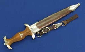 A fine WWII Historic German Gebrüder Heller Schmalkalden Ground Rohm SA Dagger with 2 piece hanger.. In very good condition. 