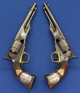 A rare and unique pair of antique American Civil War Colt model 1860 Army's 6 shot 44 caliber percussion revolvers with personalised dated 1872 grips. 8 inch barrels with New York address. In very good condition. 