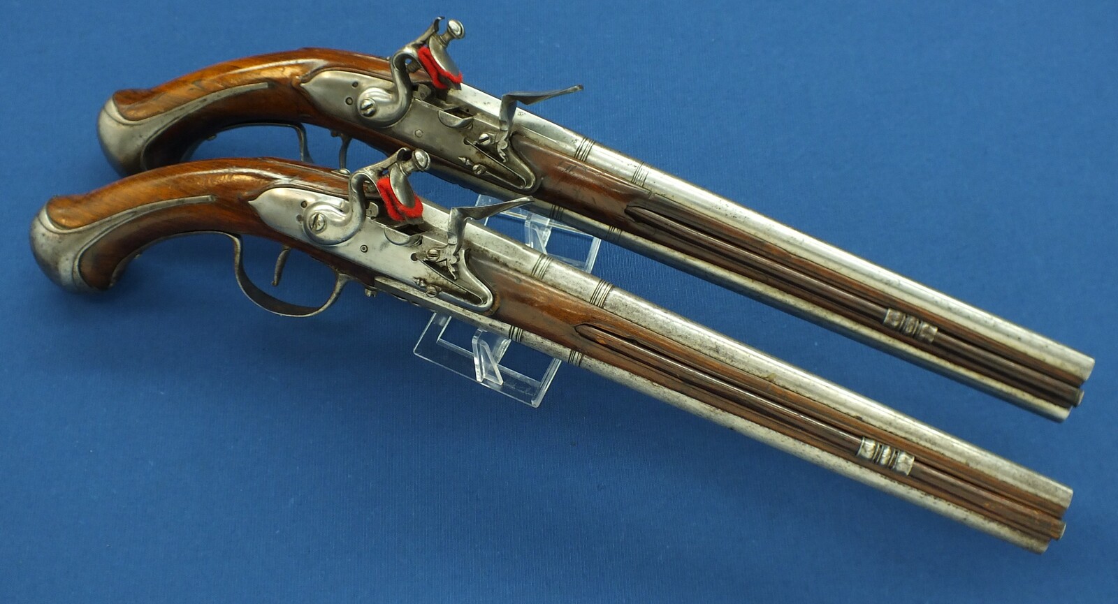 A rare antique Dutch or French 17th century circa 1660-70 Pair of over and under Flintlock pistols with Belt-hooks. Caliber 12mm, length 52. In very good condition. Price 12.500 euro.