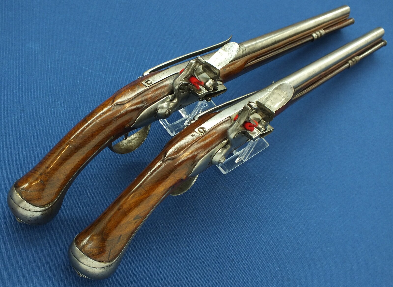 A rare antique Dutch or French 17th century circa 1660-70 Pair of over and under Flintlock pistols with Belt-hooks. Caliber 12mm, length 52. In very good condition. Price 12.500 euro.