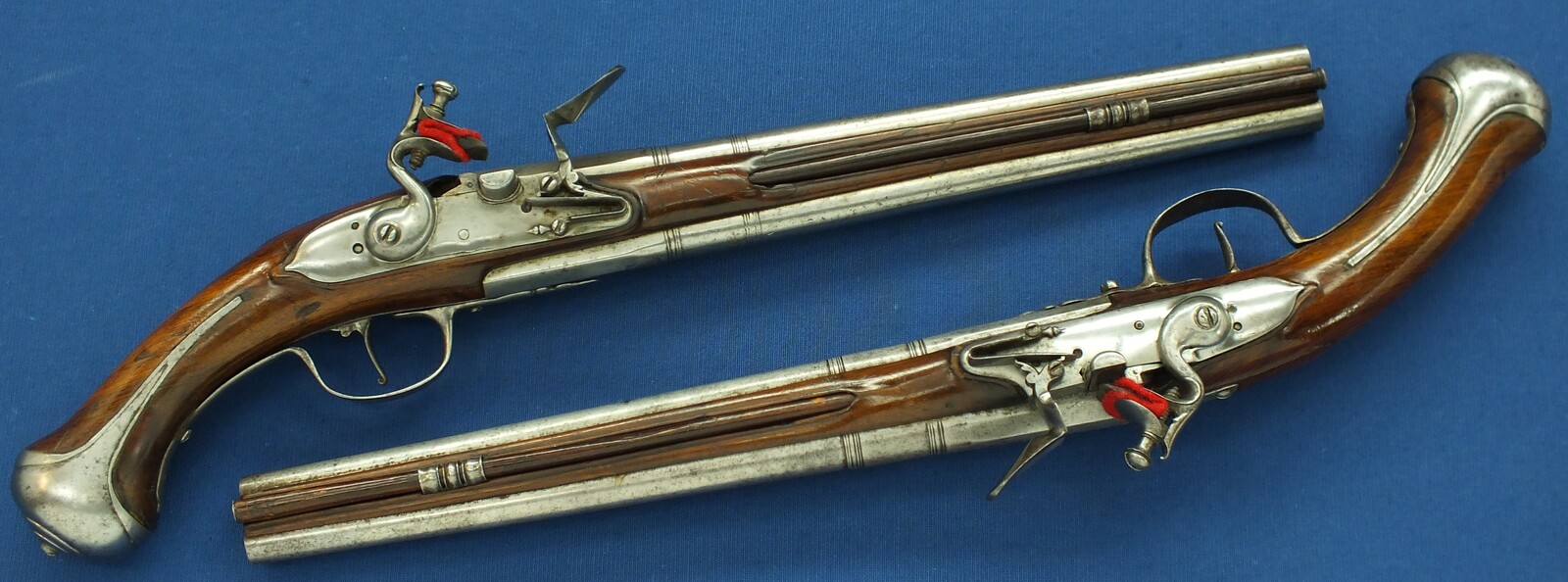 A rare antique Dutch or French 17th century circa 1660-70 Pair of over and under Flintlock pistols with Belt-hooks. Caliber 12mm, length 52. In very good condition. Price 12.500 euro.