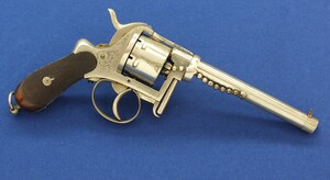 A rare antique English A. Fagnus Patent nr.1698 Nickel-plated and engraved 7 shot 9mm Pinfire Revolver. Length 28cm. In very good condition. Price 2.750 euro.