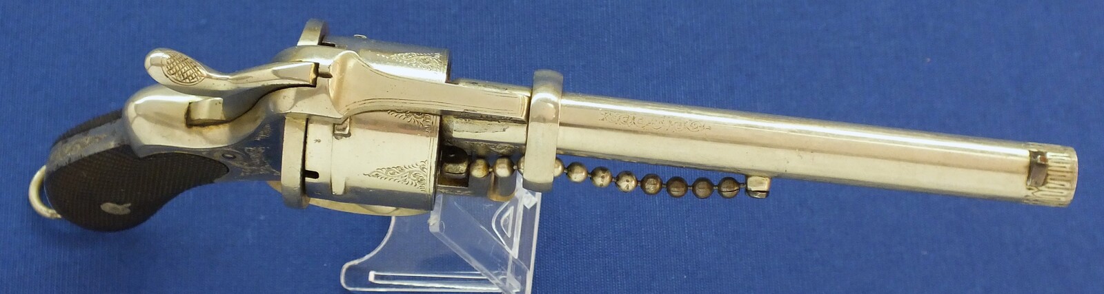 A rare antique English A. Fagnus Patent nr.1698 Nickel-plated and engraved 7 shot 9mm Pinfire Revolver. Length 28cm. In very good condition. Price 2.750 euro.