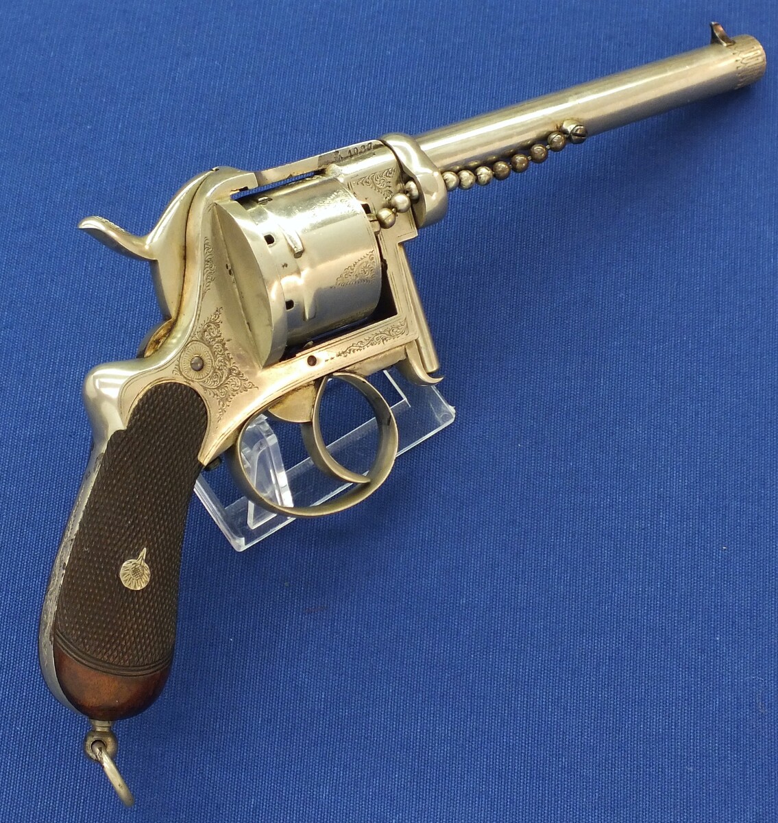 A rare antique English A. Fagnus Patent nr.1698 Nickel-plated and engraved 7 shot 9mm Pinfire Revolver. Length 28cm. In very good condition. Price 2.750 euro.