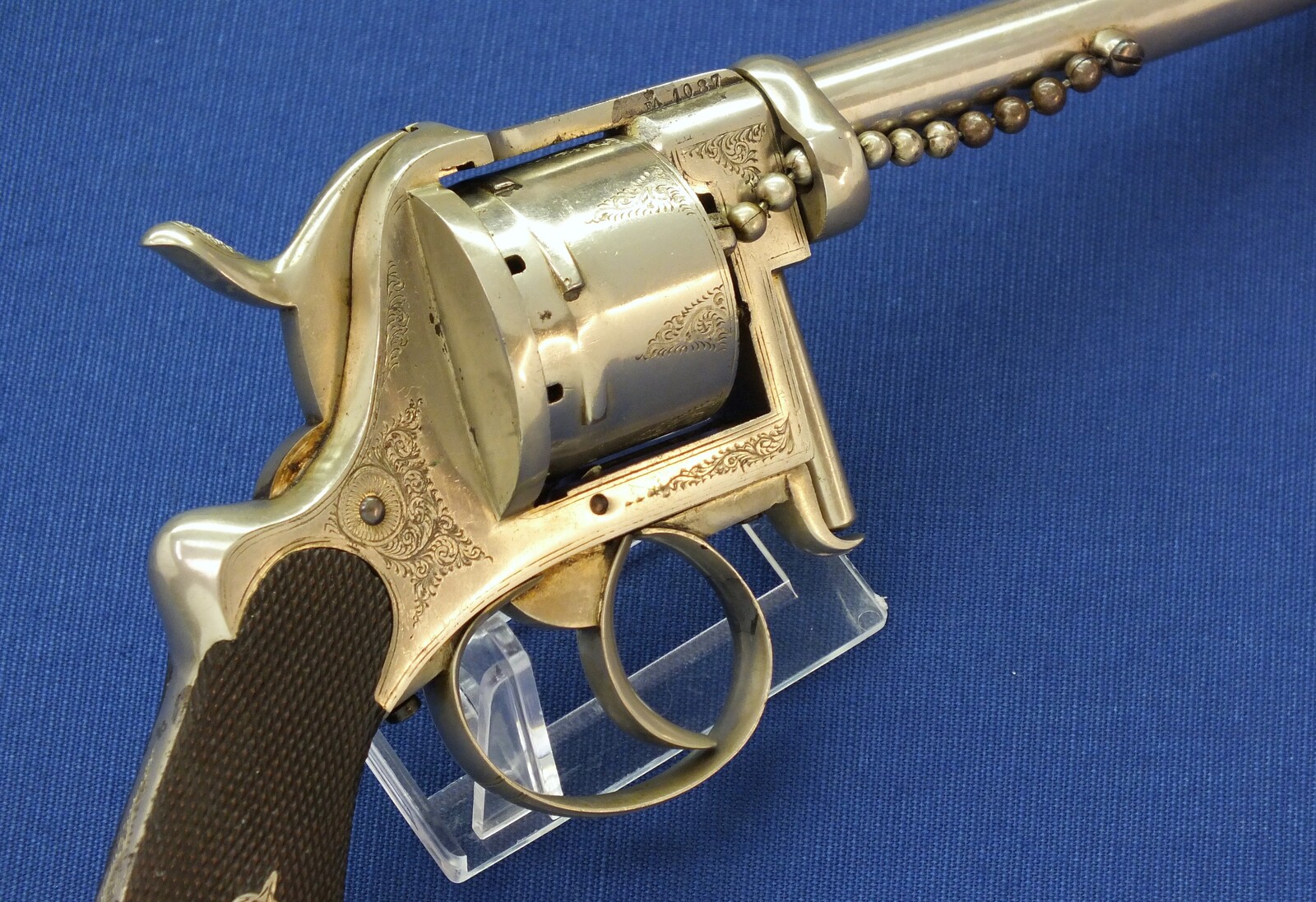 A rare antique English A. Fagnus Patent nr.1698 Nickel-plated and engraved 7 shot 9mm Pinfire Revolver. Length 28cm. In very good condition. Price 2.750 euro.