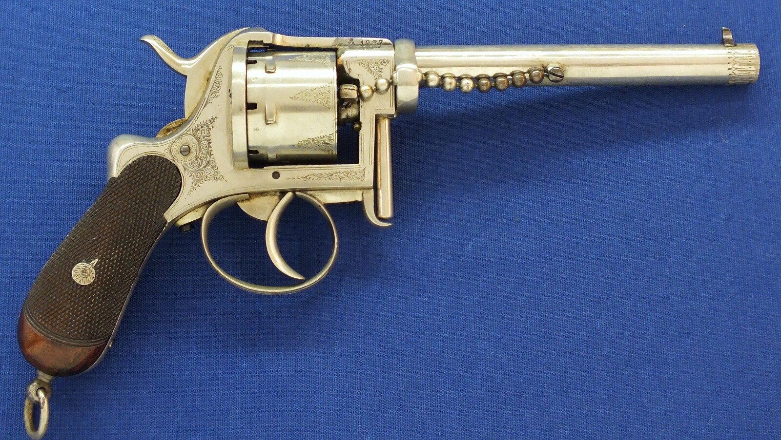A rare antique English A. Fagnus Patent nr.1698 Nickel-plated and engraved 7 shot 9mm Pinfire Revolver. Length 28cm. In very good condition. Price 2.750 euro.
