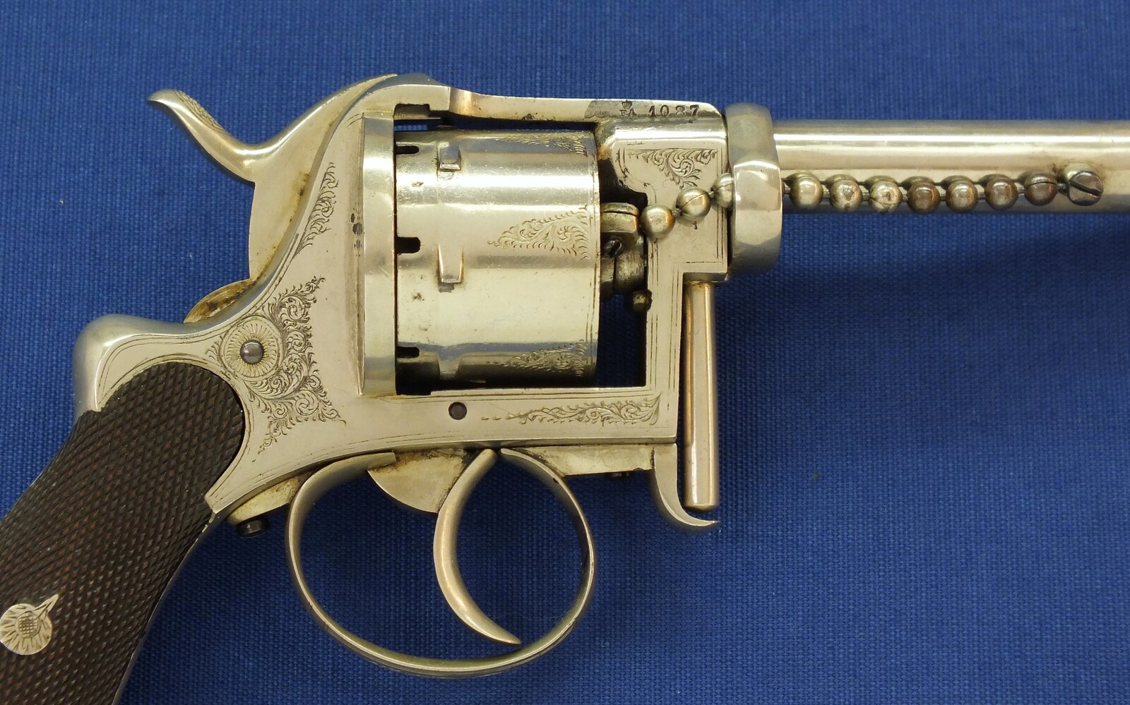 A rare antique English A. Fagnus Patent nr.1698 Nickel-plated and engraved 7 shot 9mm Pinfire Revolver. Length 28cm. In very good condition. Price 2.750 euro.