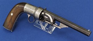 A rare antique engraved Belgian Needle-Firing 6 shot 9mm Revolver using self propelled bullets, probably made by J.J.Herman Liege. Rare Ratchet operated loader. Length 31cm. In very good condition. 
