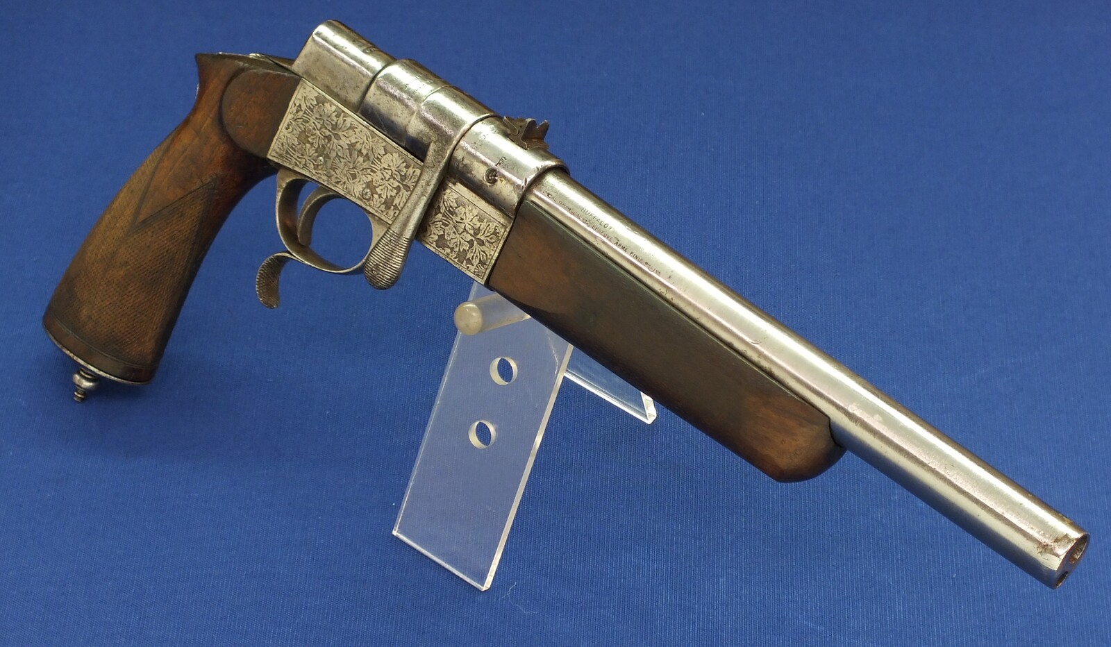 A rare French Buffalo-Stand Euréka bolt action 2 shot caliber 6mm and 9mm Rimfire Flobert Pistol. Length 40cm. In good condition. With original catalogue. Price 695 euro