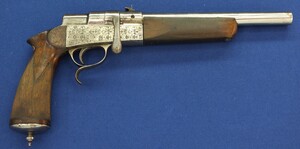 A rare French Buffalo-Stand Euréka bolt action 2 shot caliber 6mm and 9mm Rimfire Flobert Pistol. Length 40cm. In good condition. With original catalogue. Price 750 euro