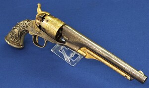 A Scarce antique American Colt Model 1860 Army 6 shot 44 caliber Percussion Revolver. Silver & Gold plated and engraved by L.D. Nimschke with Tiffany Grip with the Civil War Battle Scene's and American Eagle. In very good condition.