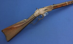 A scarce antique American Winchester first Model 1873 Saddle Ring Carbine with original cleaning rods. Caliber 44-40. 20 inch barrel with clear address. Made 1878. Length 99cm. In very good condition. Price 5.500 euro.