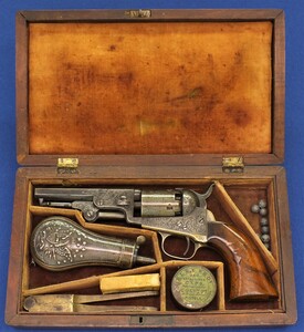A scarce antique cased factory Gustave Young engraved Colt Model 1849 5 shot 31 caliber single action Pocket Percussion Revolver with 4 inch barrel with rare script Sam Colt address. In very good condition. Price 14.950 euro