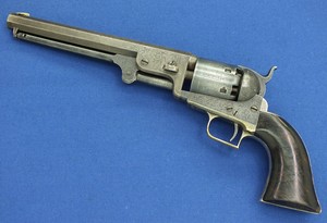 A scarce antique Factory Engraved Second Model 1851 Square- Back Trigger Guard  Colt Navy Percussion Revolver, .36 caliber, 7 1/2 inch octagon barrel, length 35 cm, in very good condition.