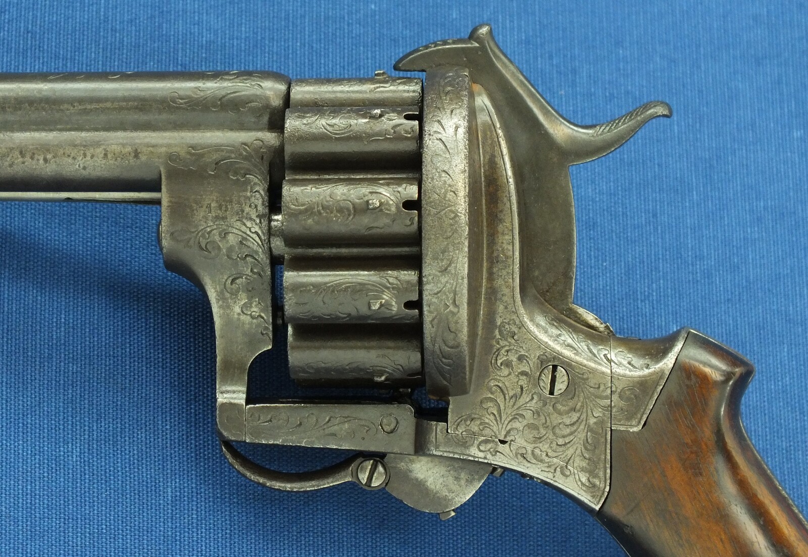 A scarce antique French 20 shot Pinfire Revolver. Signed on barrel: E. Lefaucheux Brevete a Paris. 7mm Caliber, length 27cm. In good/very good condition. Price 1.950 euro.