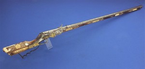 A scrarce unrestored antique Polish 17th Century Teschinke-Teschen Wheellock Rifle. Engraved Bone and mother of pearl inlay's in Walnut stock.Length 129 cm, 9mm caliber. In fair/good condition. 