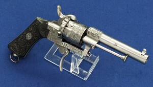 A very nice engraved Belgian Eugene Lefaucheux 6 shot 7mm caliber single and double action Pinfire Revolver with fine carved Ebony grips. Length 21cm. In very good condition. Price 775 euro