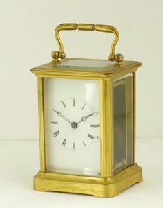 A very nice gilded antique 19th century English Carriage Clock, height 15 cm. Price 350 euro