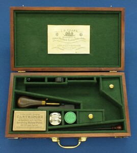 A Vintage Walnut case refitted and relined green interior made to fit Rogers & Spencer Single Action Army Revolver. 39x22x6cm. In very good condition. 