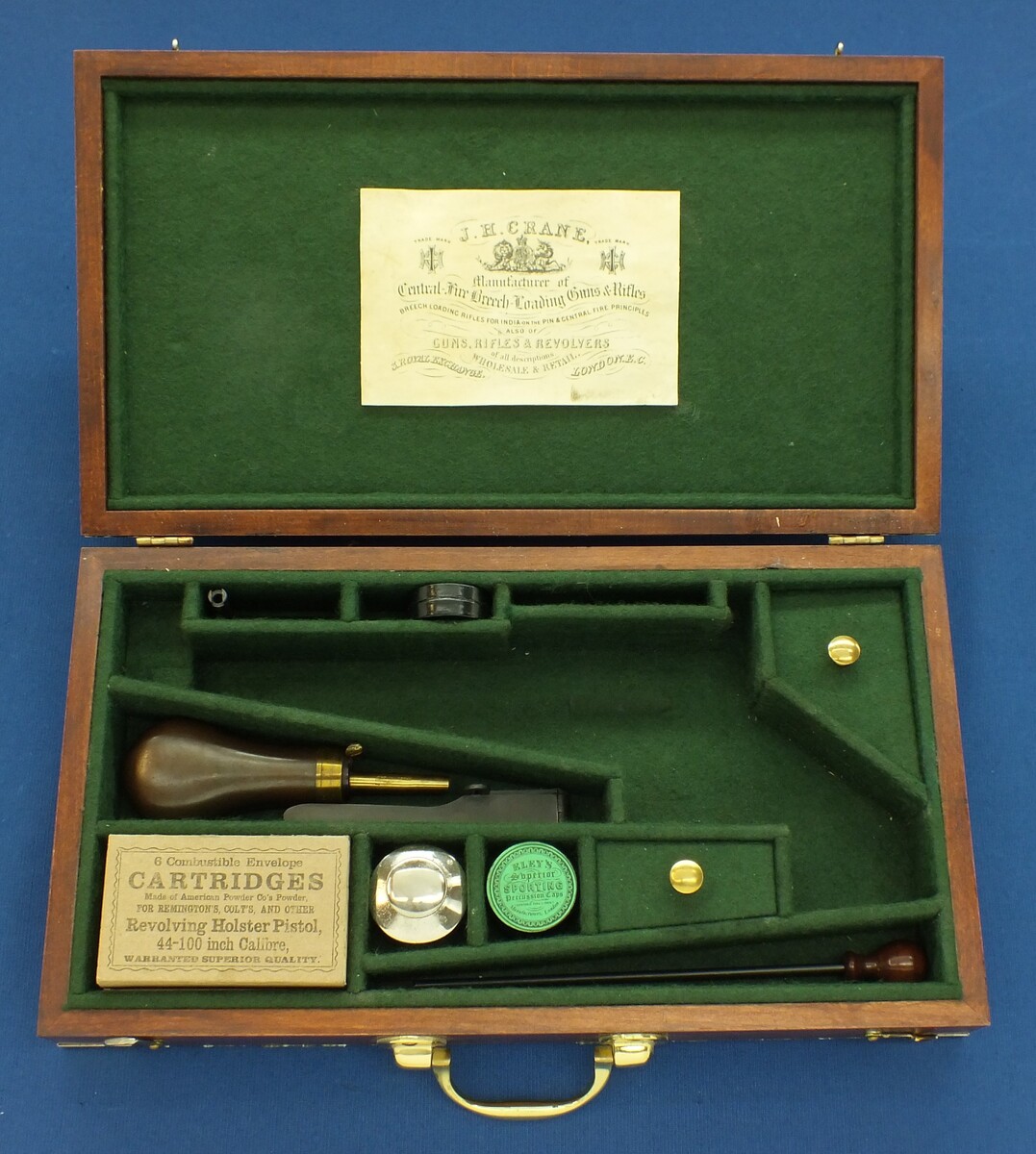 A Vintage Walnut case refitted and relined green interior made to fit Rogers & Spencer Single Action Army Revolver. 39x22x6cm. In very good condition. Price 350 euro.